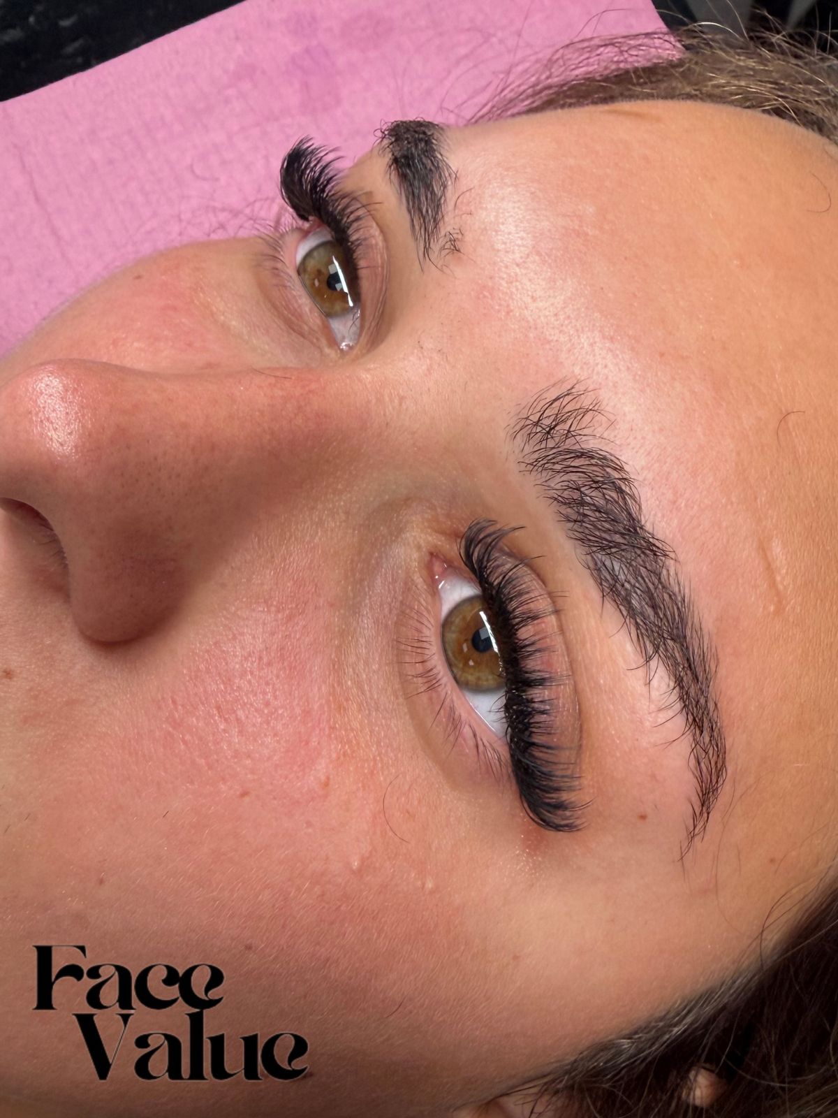 Lash set over a hazel eye with a full brow