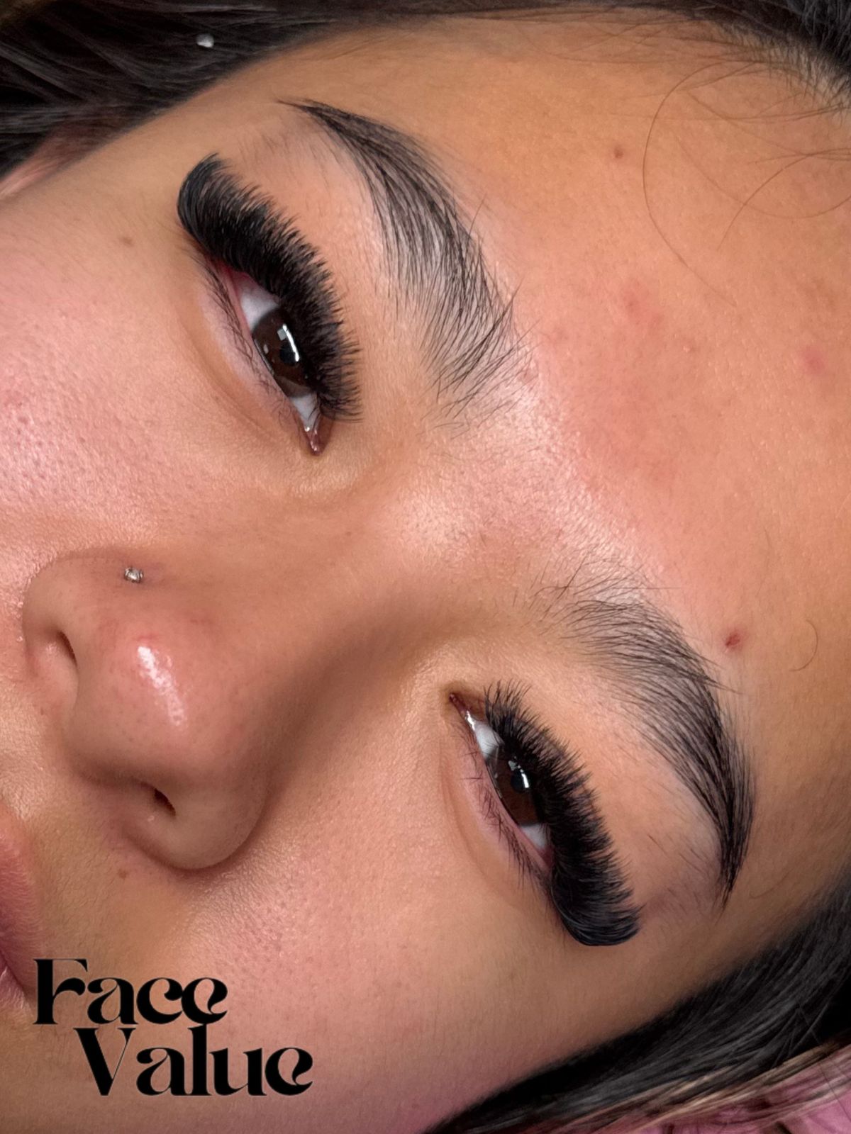 A fresh lash set with a full, dark lash line and a groomed brow